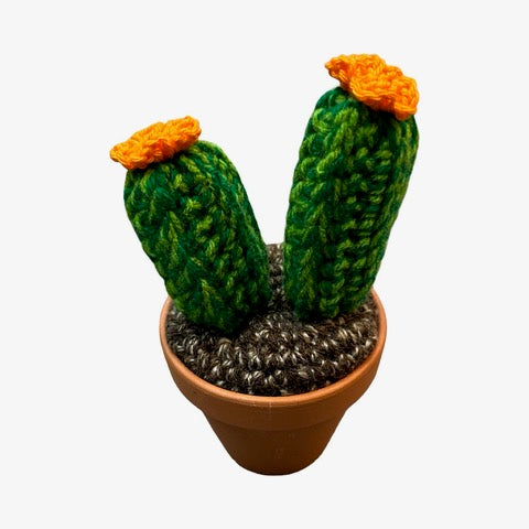 Handmade 2 pronged crochet cactus with orange flowers.