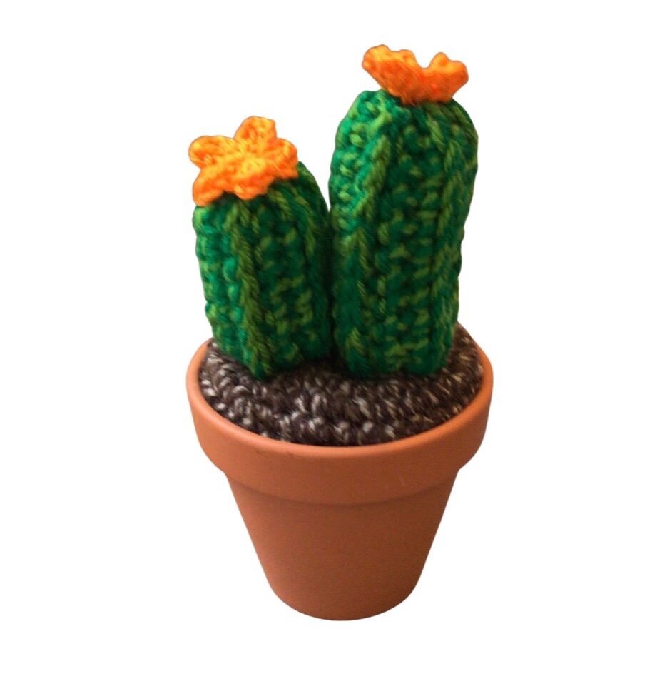 Handmade 2&nbsp;pronged crochet cactus with orange flowers.