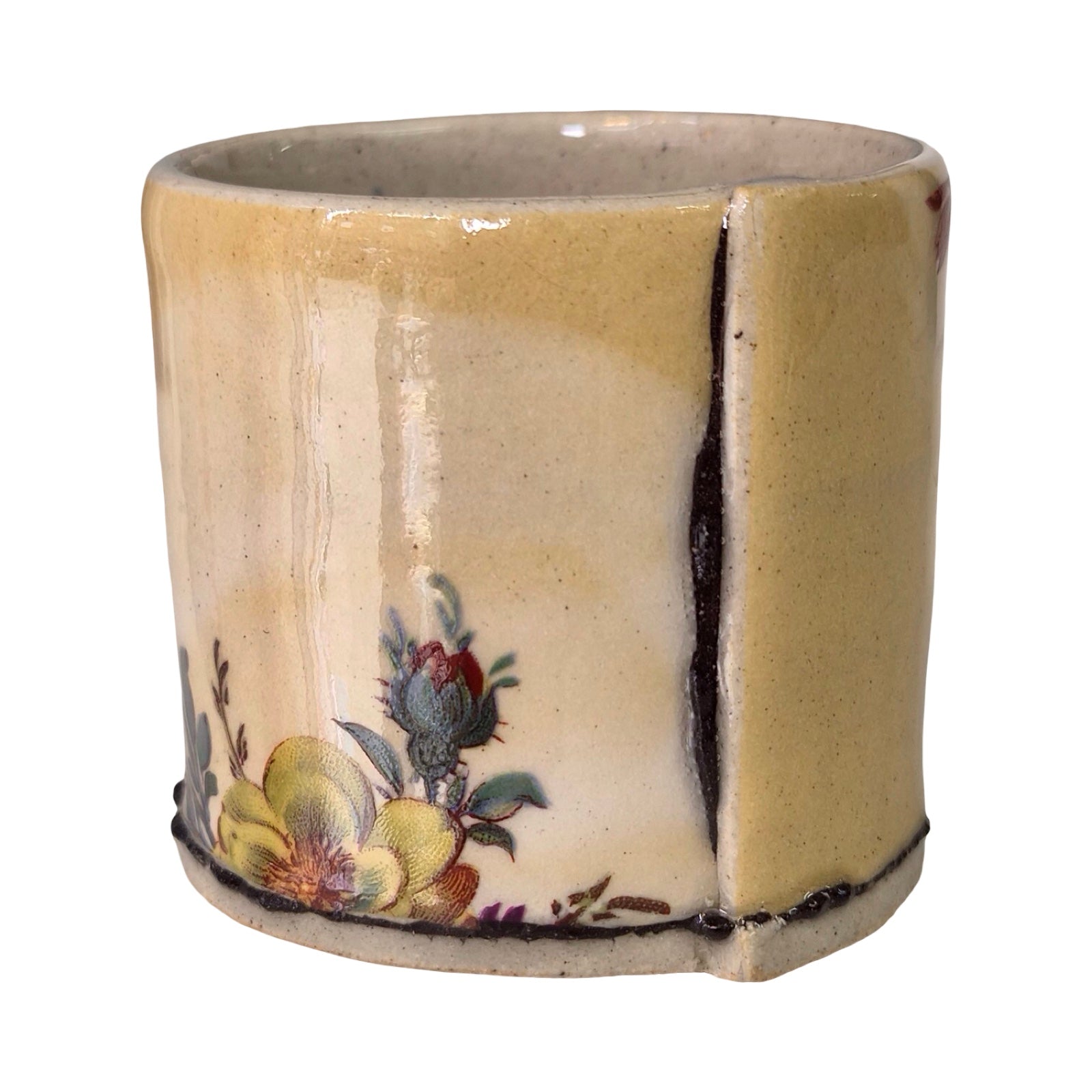 Ceramic planter with floral design on a white background.