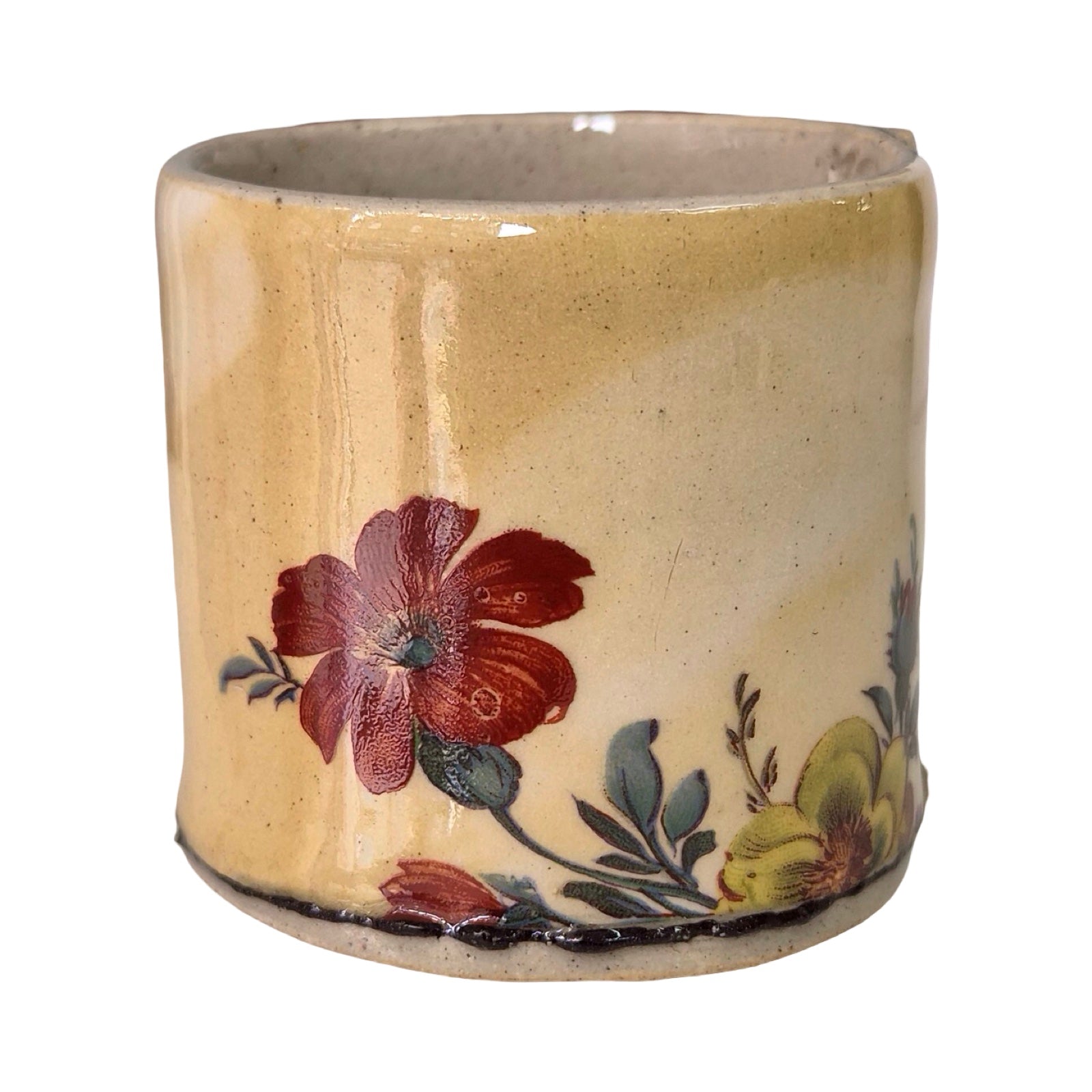 Ceramic planter with floral design on a beige background.