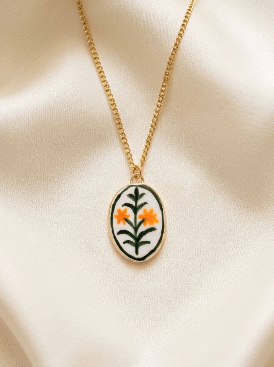 Necklace with a floral pendant on a beige background.