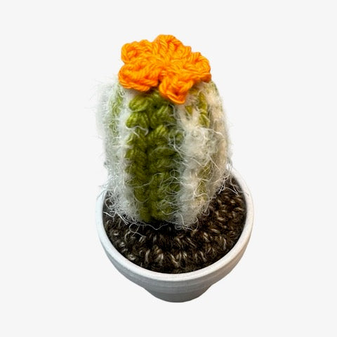 Handmade tall crochet cactus with an orange flowers. 