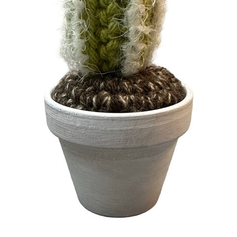 Handmade tall crochet cactus with an orange flowers. 