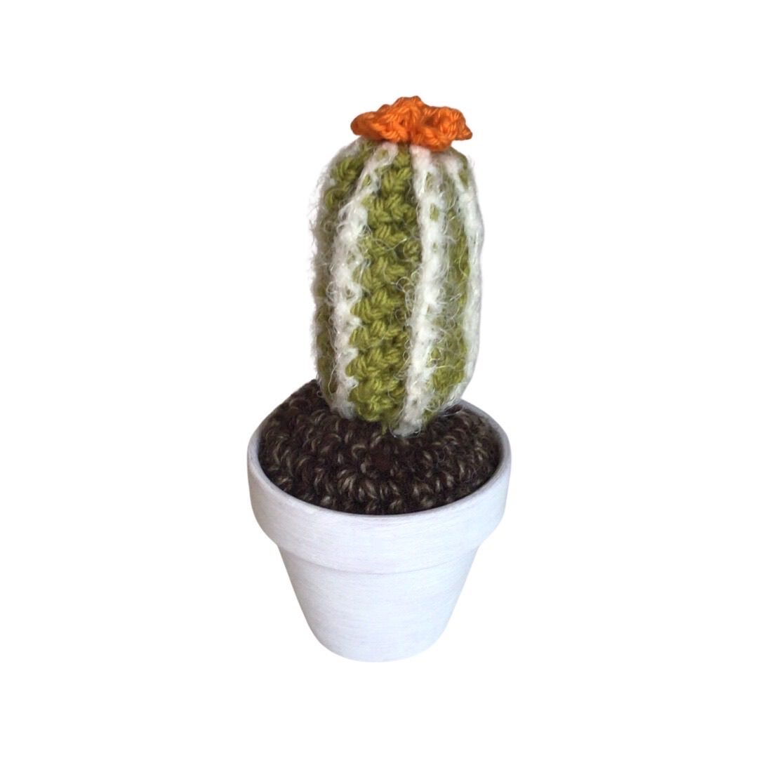 Handmade tall crochet cactus with an orange flowers. 