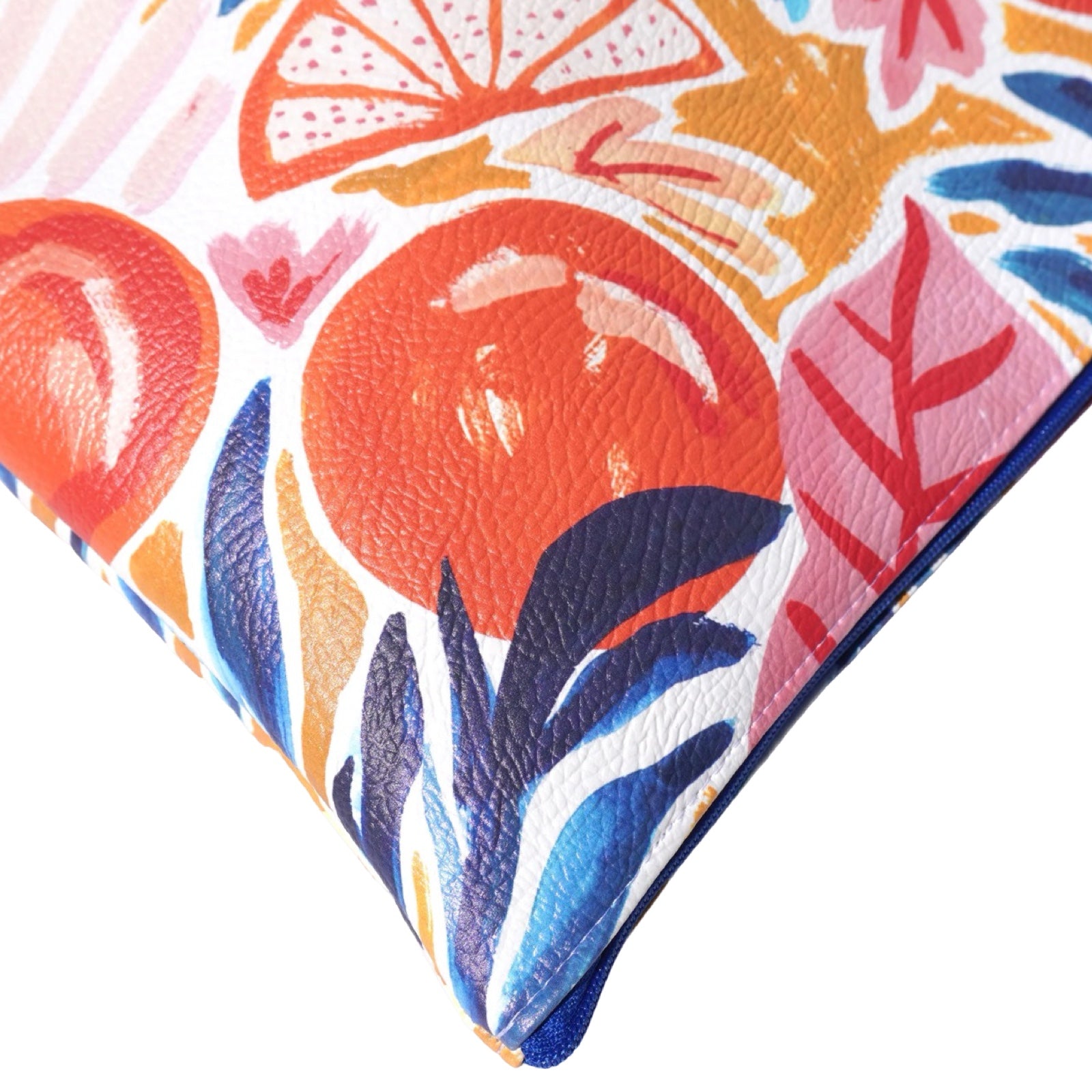 Vegan leather bag with a bright oranges design featuring blue and pink leaves, and the bag is finished with a fabulous matching tassel on the end of the zip. 