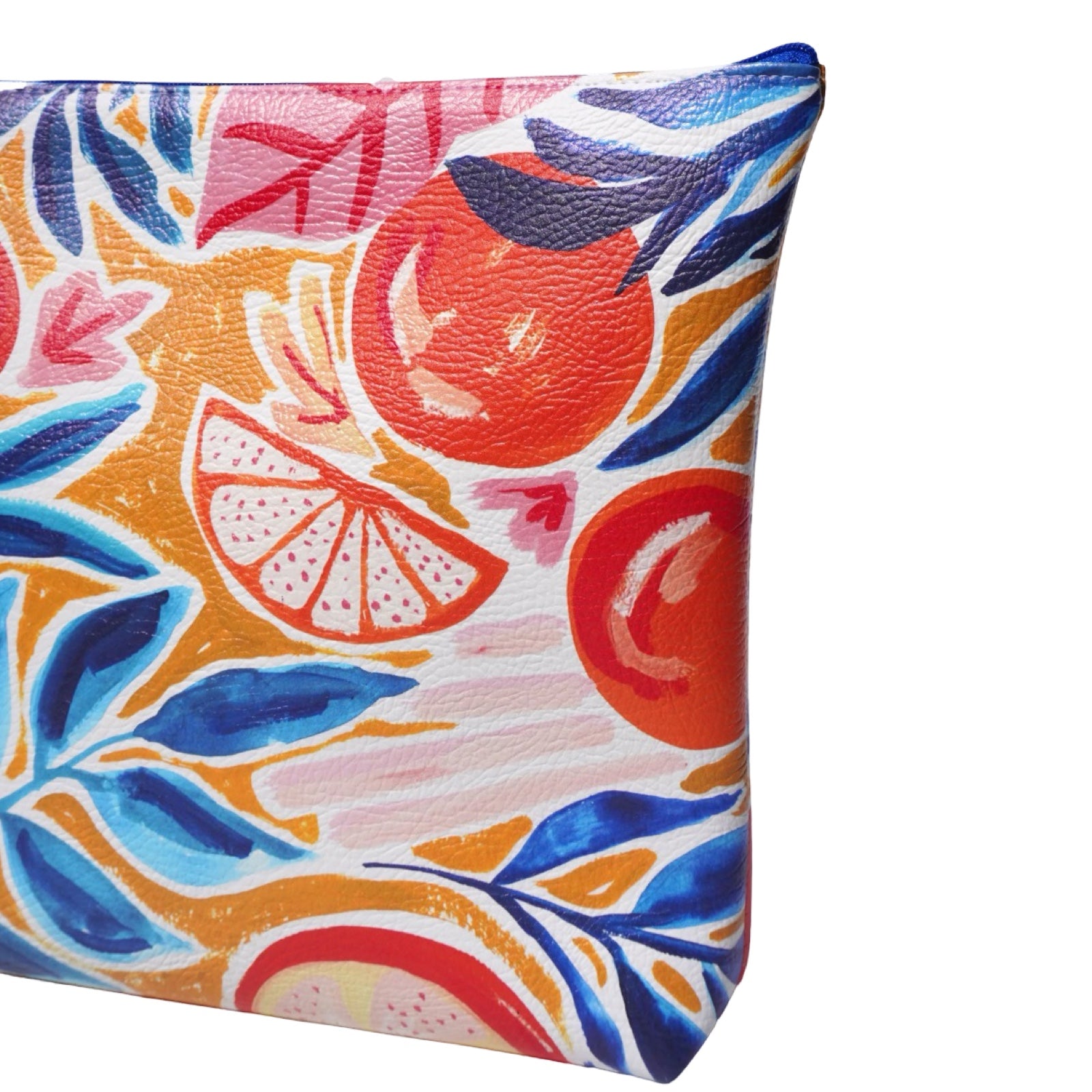 Vegan leather bag with a bright oranges design featuring blue and pink leaves, and the bag is finished with a fabulous matching tassel on the end of the zip. 