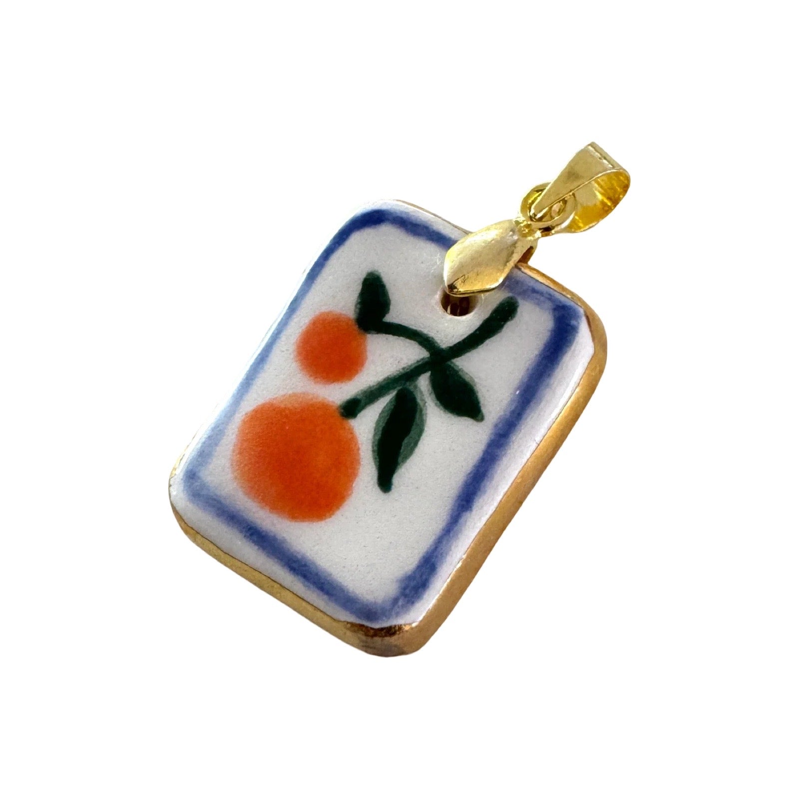 Decorative pendant with fruit design on a white background.