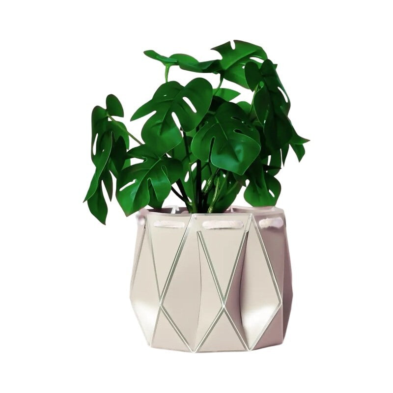 A white coloured recycled plastic plant pot with a green plant inside