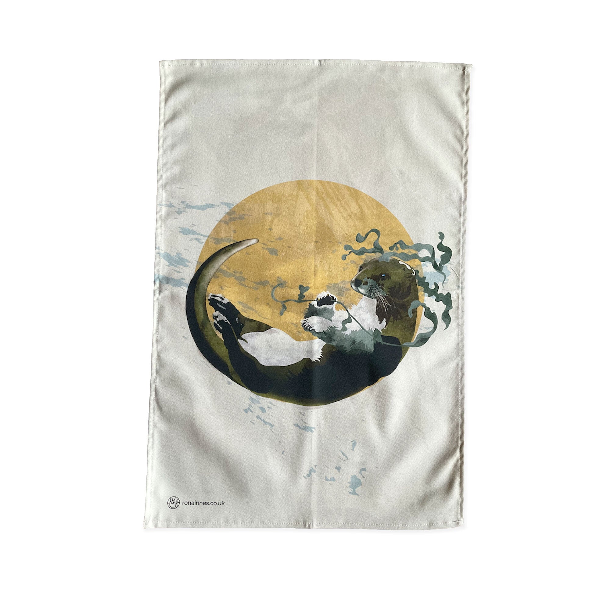 A tea towel featuring an illustration of an otter, in a mustard circle against an off-white background. 