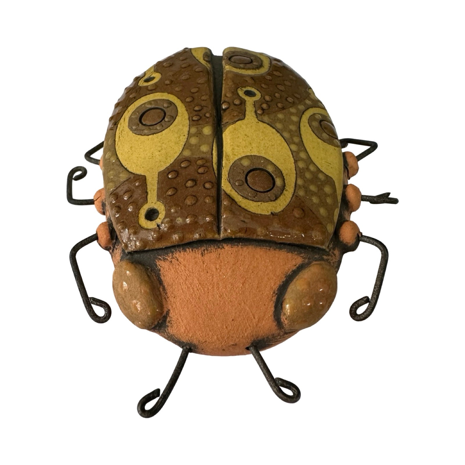 Ceramic beetle decorated in brown with a yellow paddle-shaped pattern.