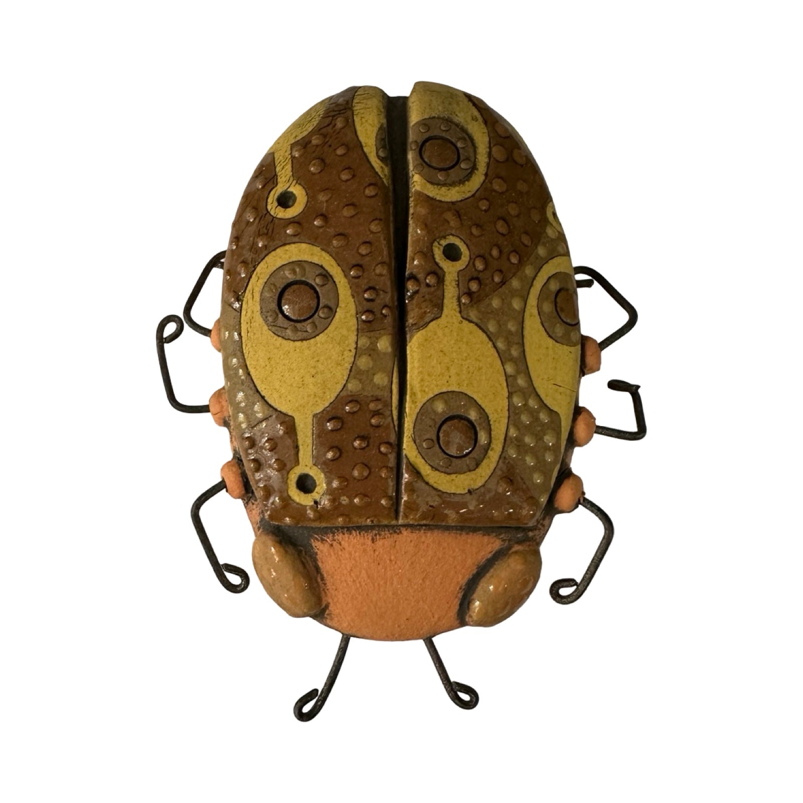 Ceramic beetle decorated in brown with a yellow paddle-shaped pattern.
