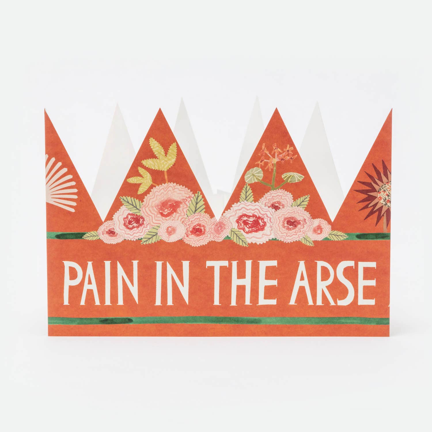 Decorative paper crown with floral design and text on a white background.