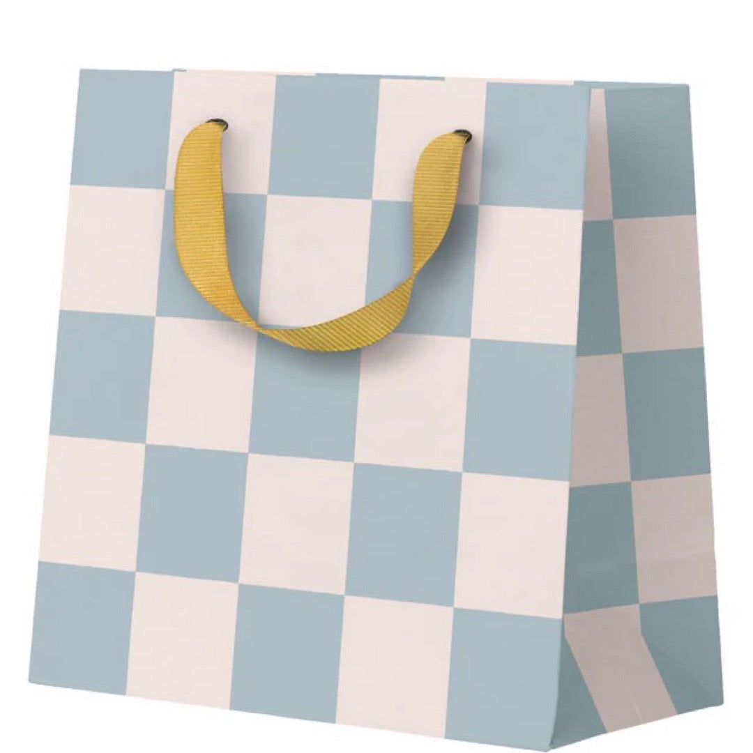 Checkered gift bag with yellow handles on a white background.