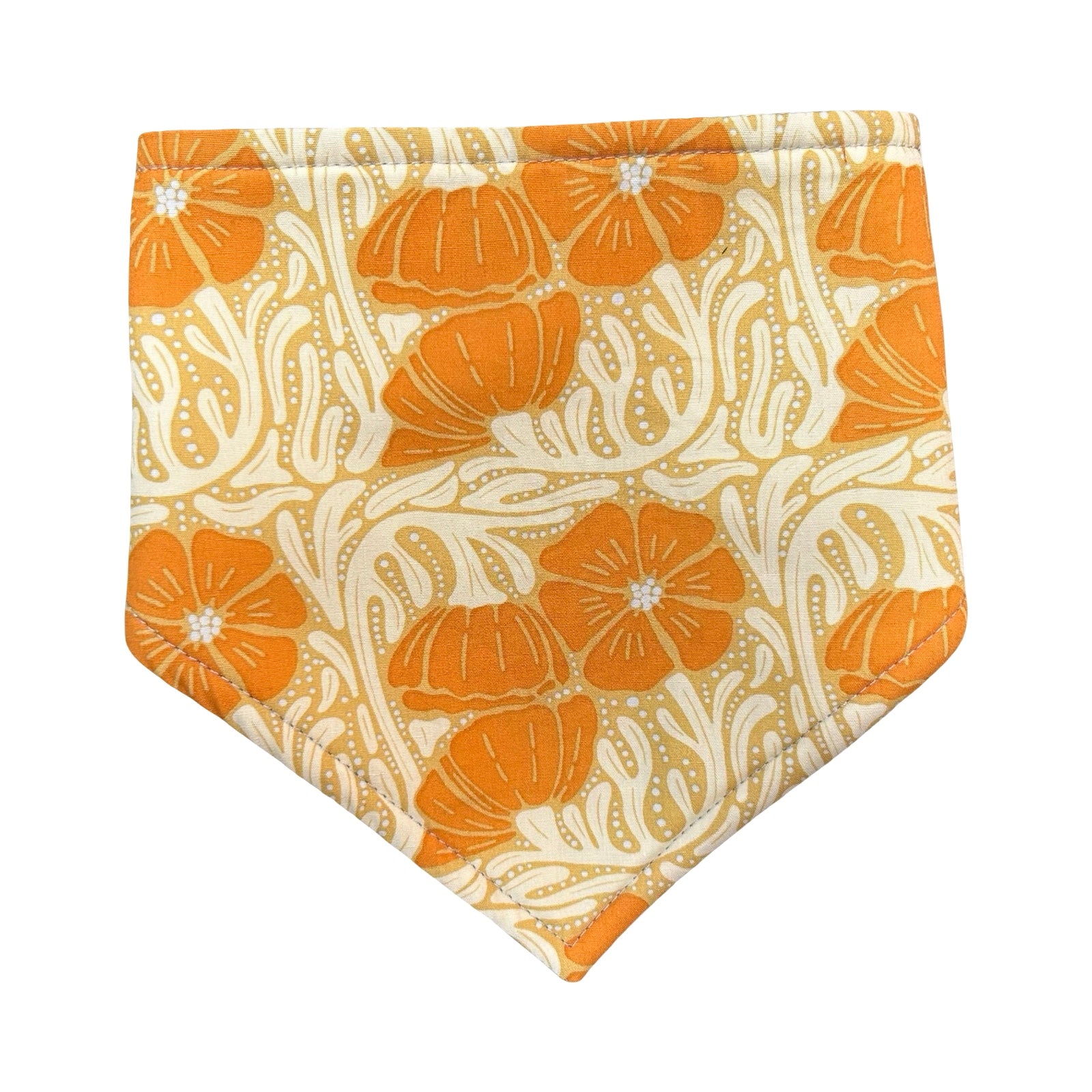 Floral patterned fabric with orange flowers on a beige background.