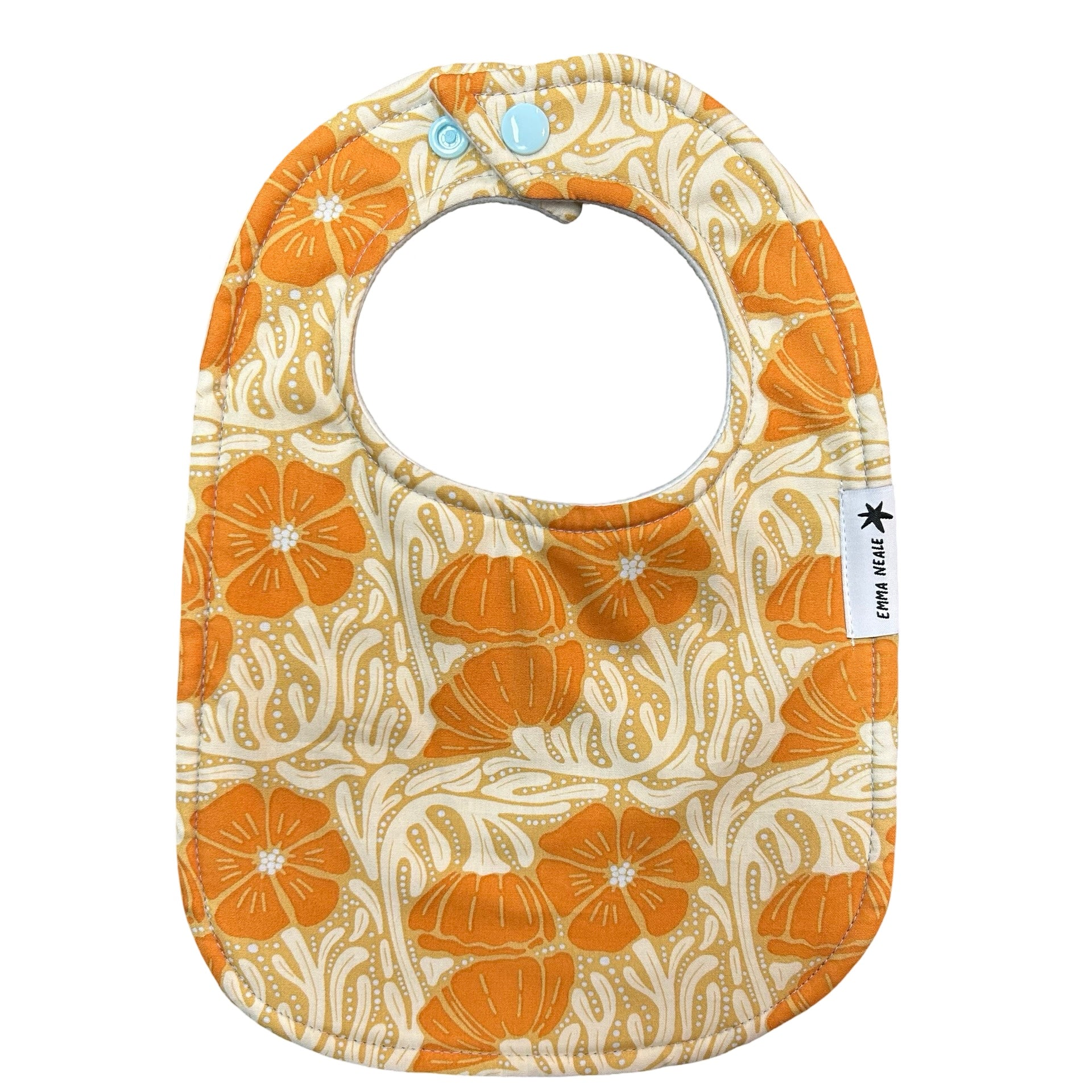 Baby bib in orange pansy patch fabric with adjustable snaps.