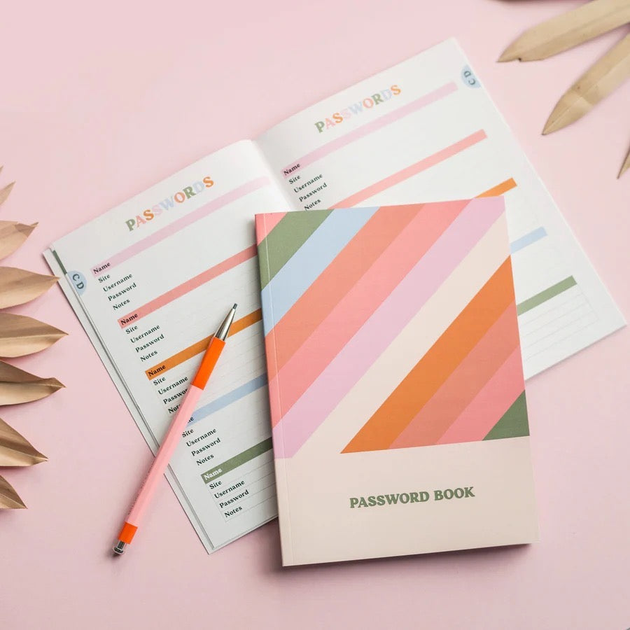 Password book with geometric design on a pink background.