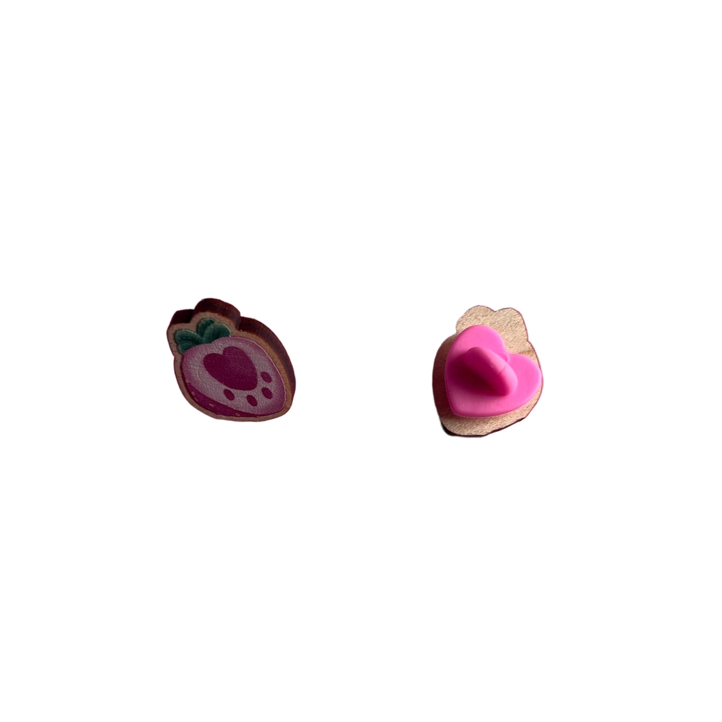 Mini wooden pin badge of a pink pawberry (heart-shaped strawberries with a paw shape inside). This badge is printed onto 3mm thick responsibly sourced European birch plywood.