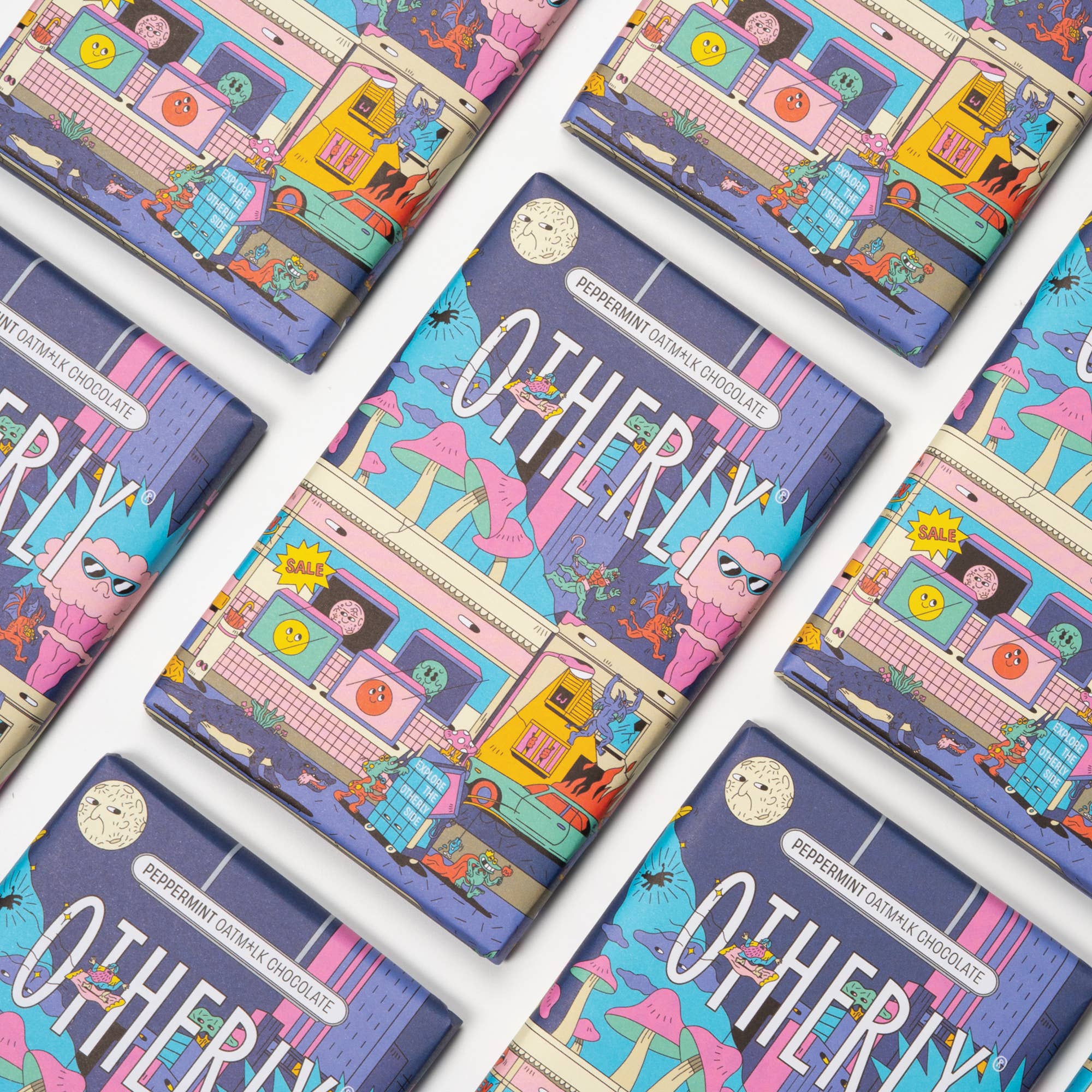 Colourful chocolate bars with 'Otherly' branding on a white background.