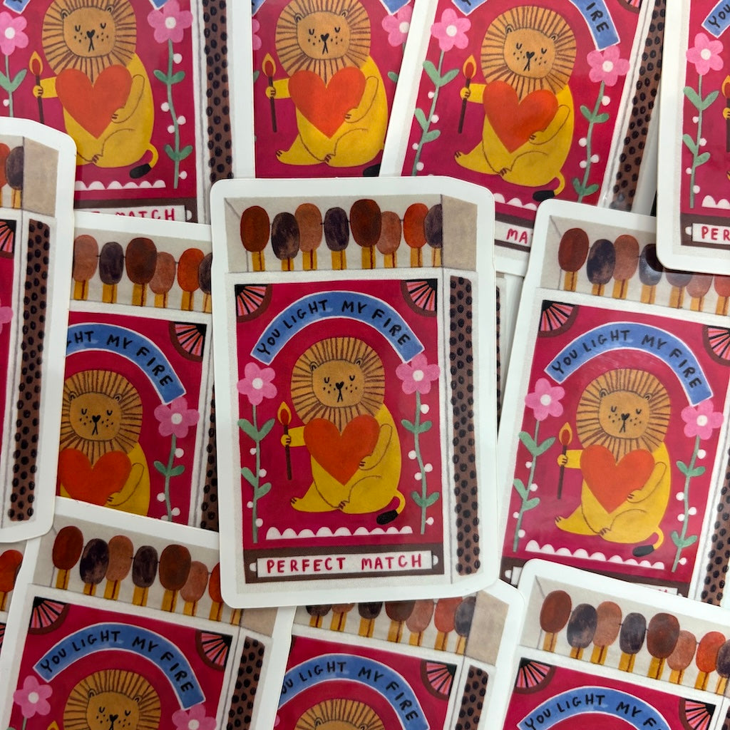 Matchbox cards with a lion design and 'Perfect Match' text on a pink background.