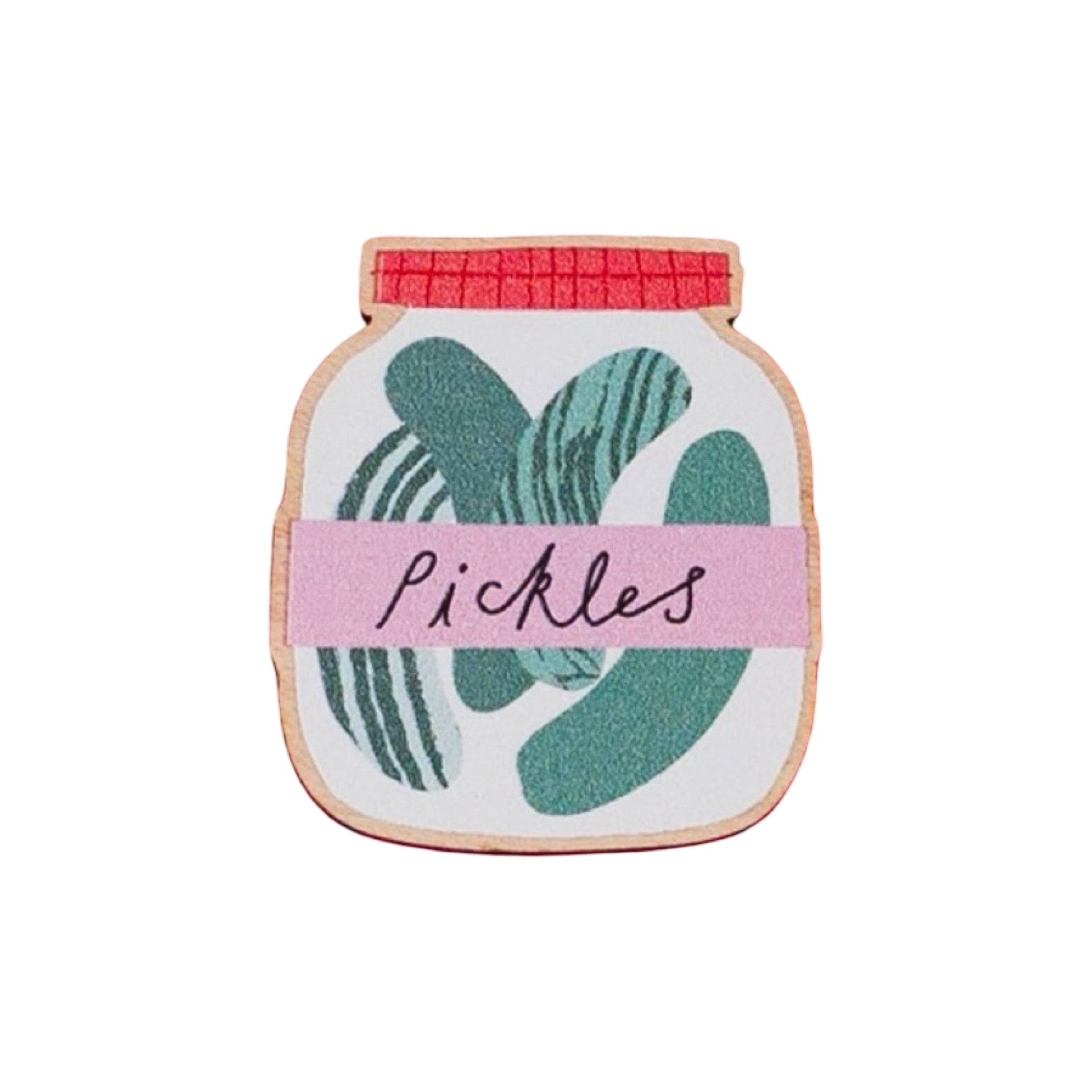 A jar-shaped enamel pin featuring green pickle illustrations, a pink band across the middle with the word 'Pickles' in black script, and a red lid, all outlined in gold-toned metal.