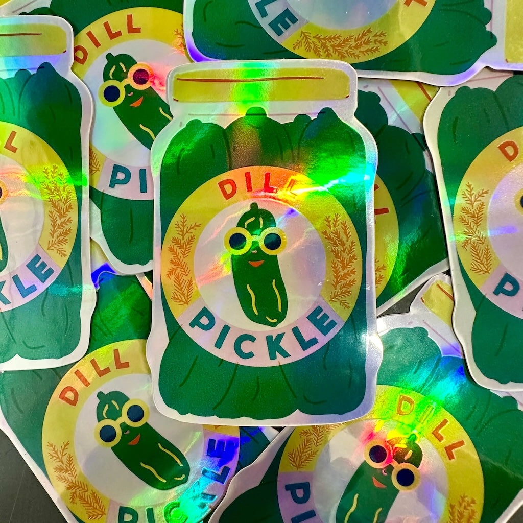Pile of holographic stickers of a jar of pickles.