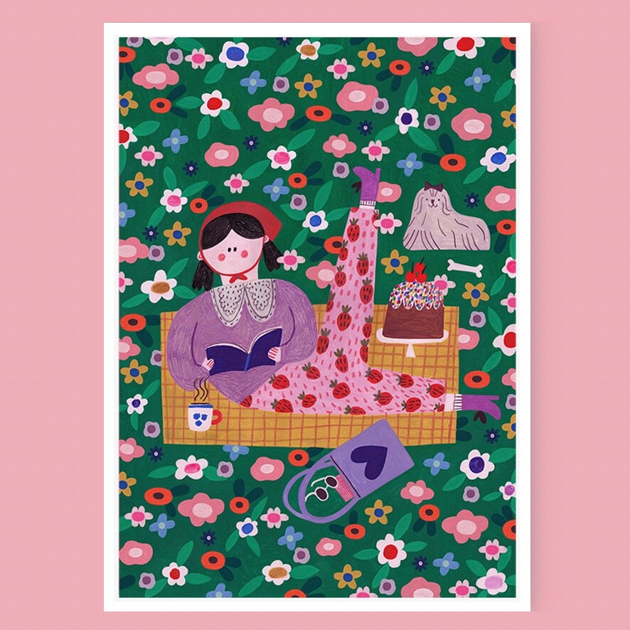 This art print features a lady dressed in fabulous strawberry-covered trousers out for a picnic in a flowery meadow, on a pink background.