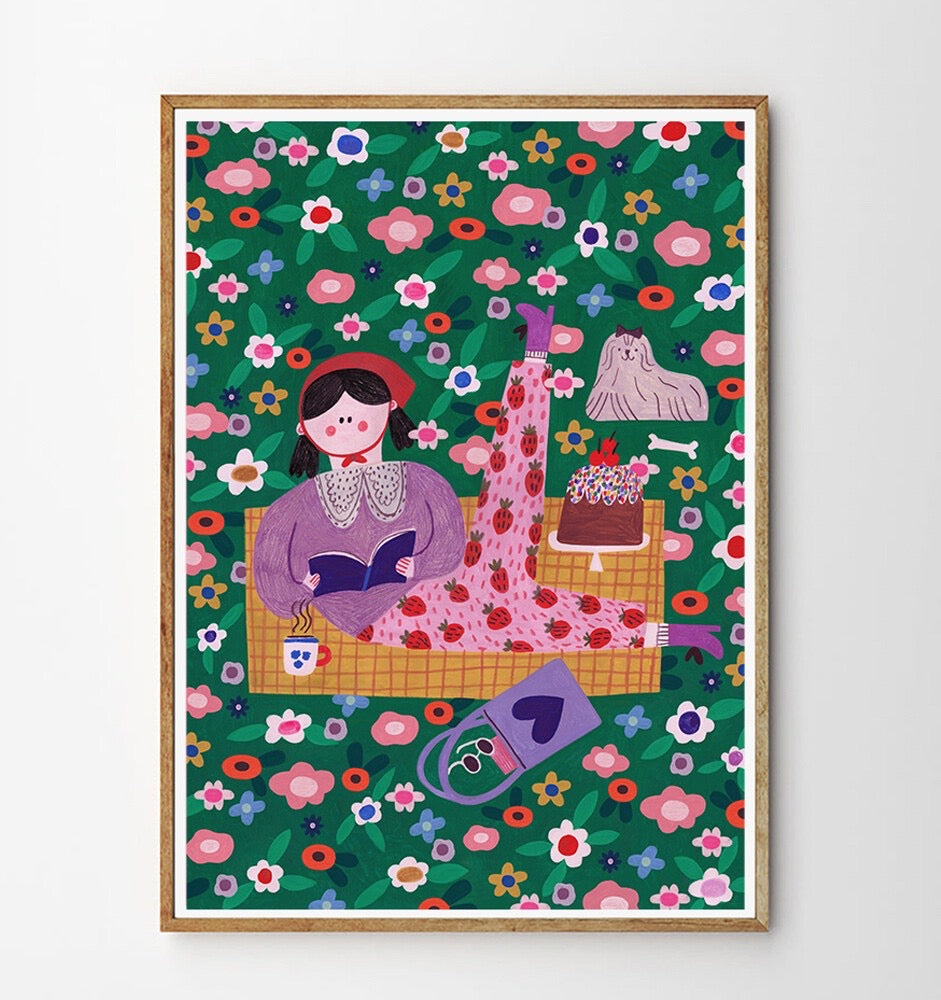 Colourful illustration of a girl reading a book  in a field with a dog and flowers on a green background.