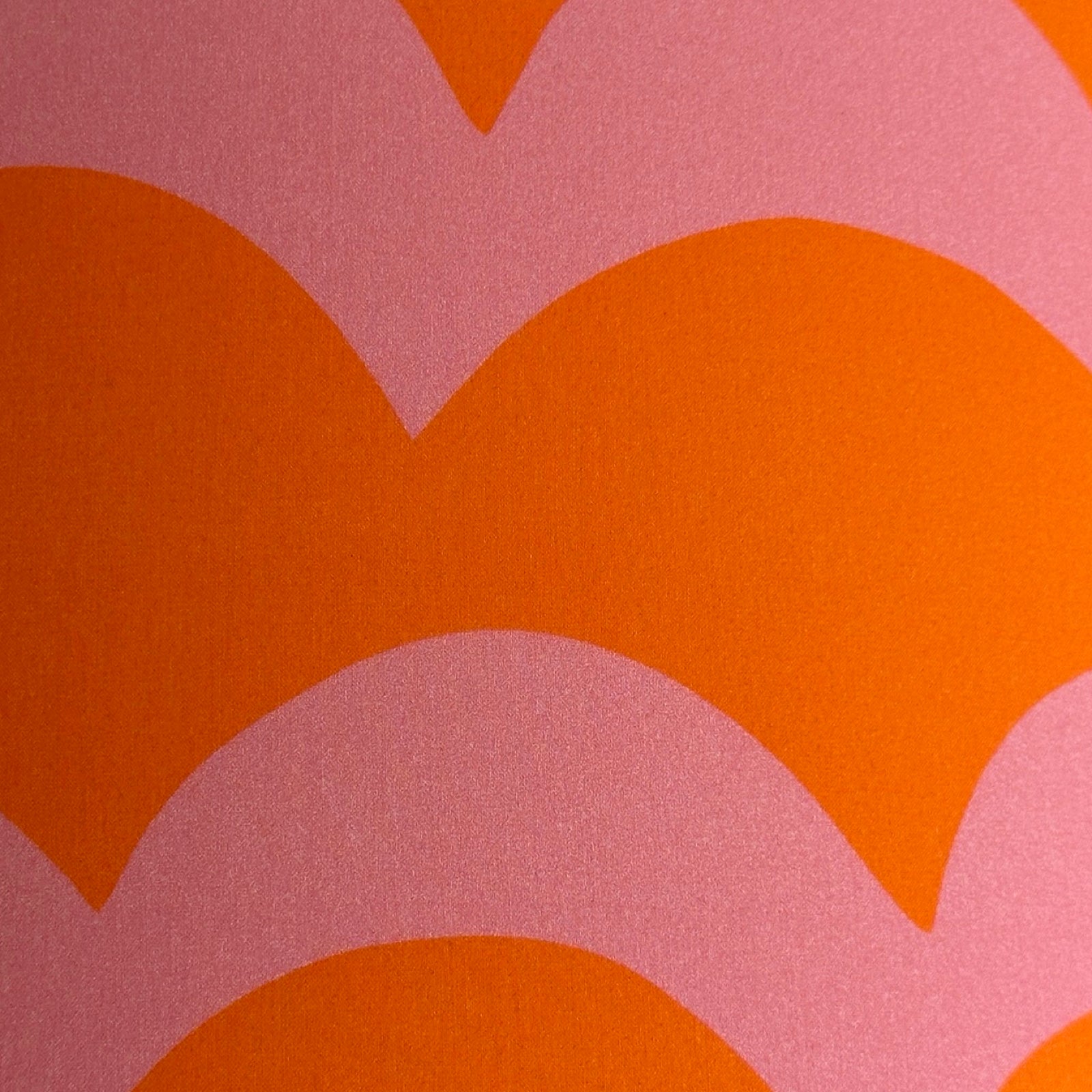 Orange and pink cotton fabric with a wave design