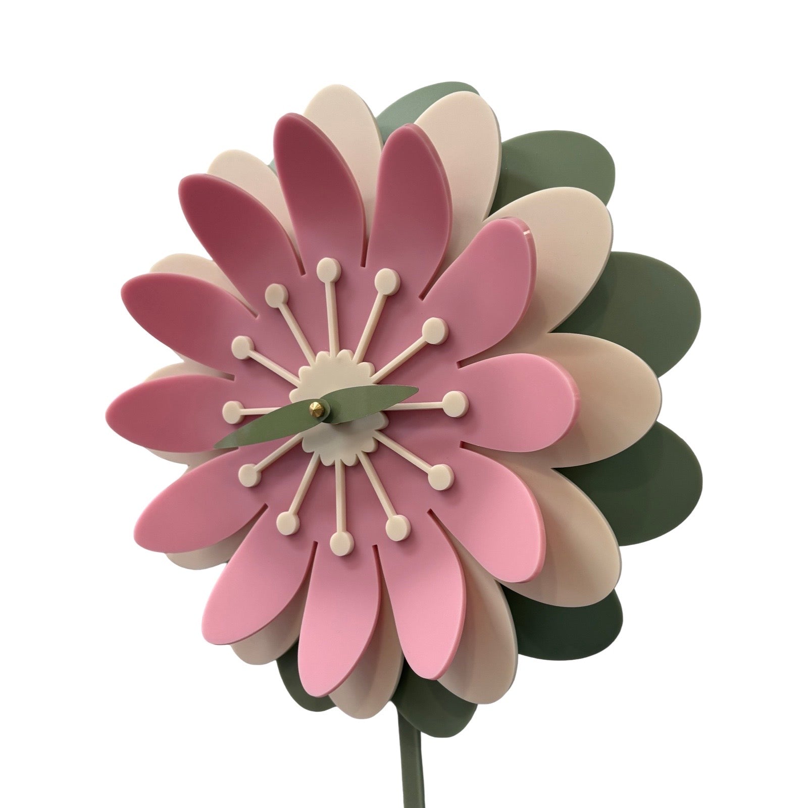 Decorative flower-shaped clock with pink, beige, and green petals on a white background.