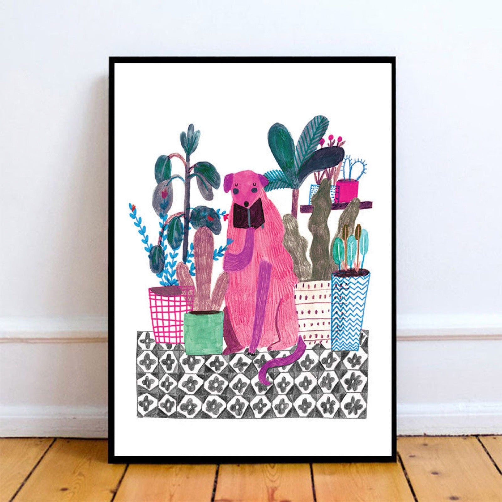 Framed artwork of a pink dog among potted plants on a patterned rug, leaning against a wall.