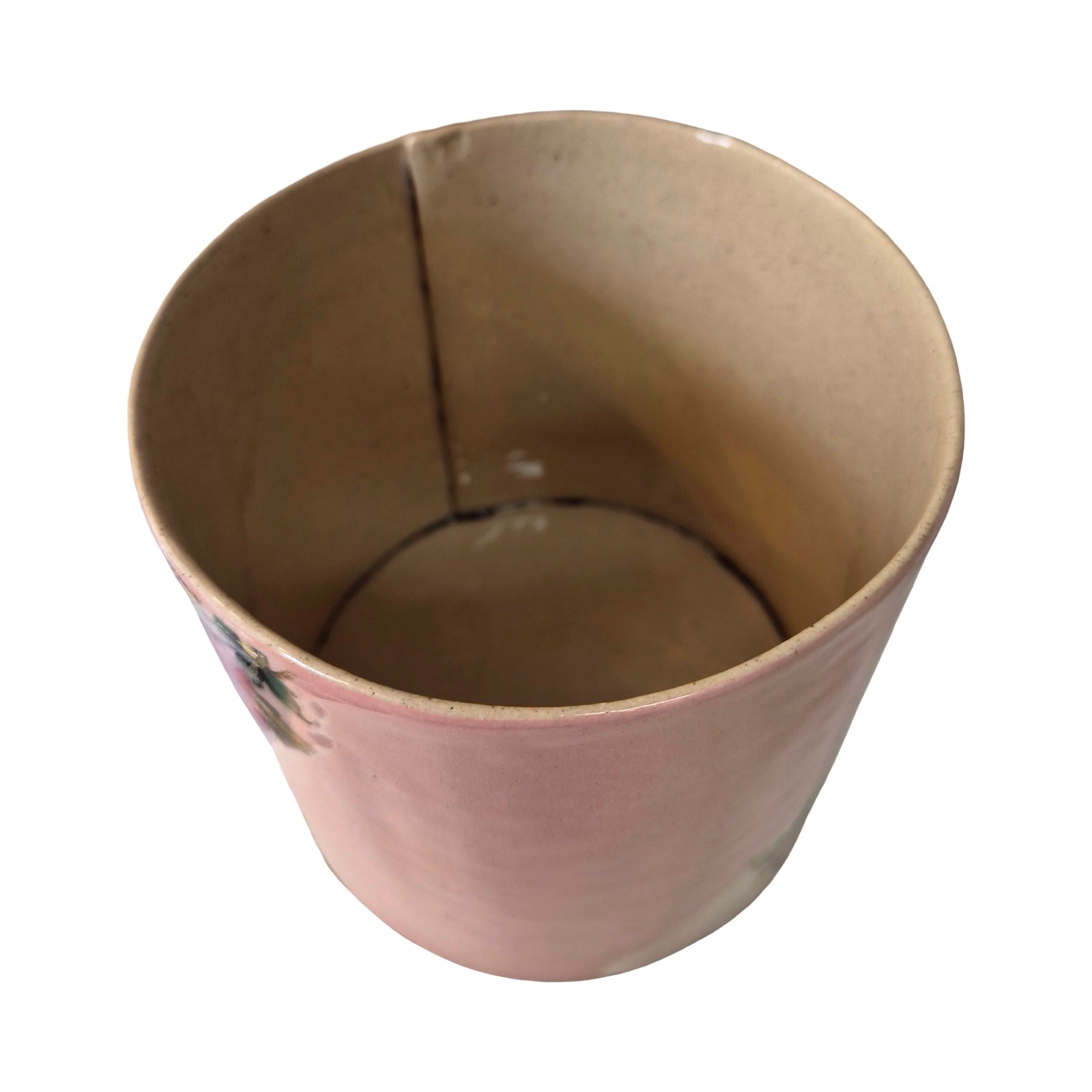 Inside of ceramic planter with a crack on a white background.