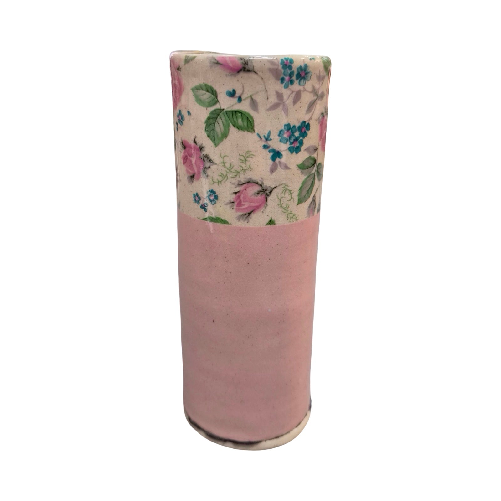 Cylindrical vase with floral patterned top on a white background.