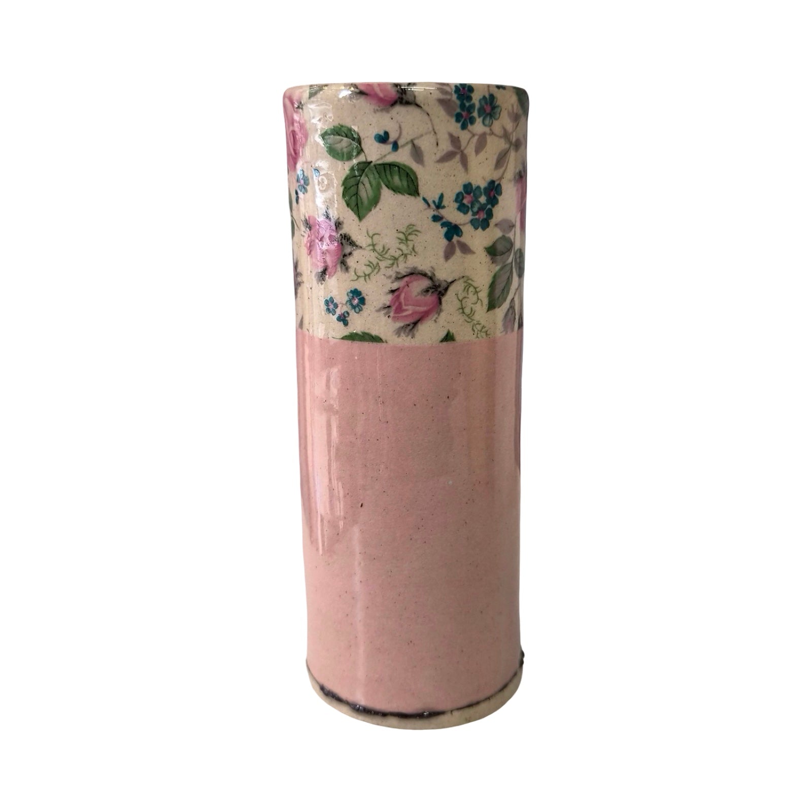 Cylindrical vase with floral patterned top on a white background.