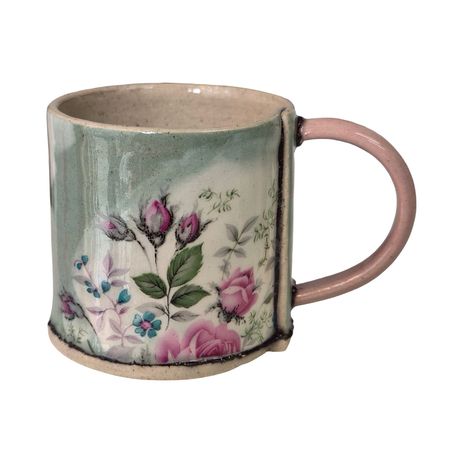 Ceramic mug with floral design on a white background.