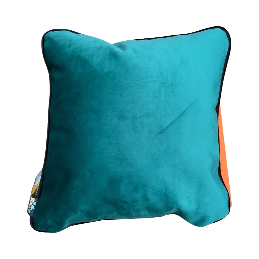 Turquoise velvet back of the pink panthers cushion.