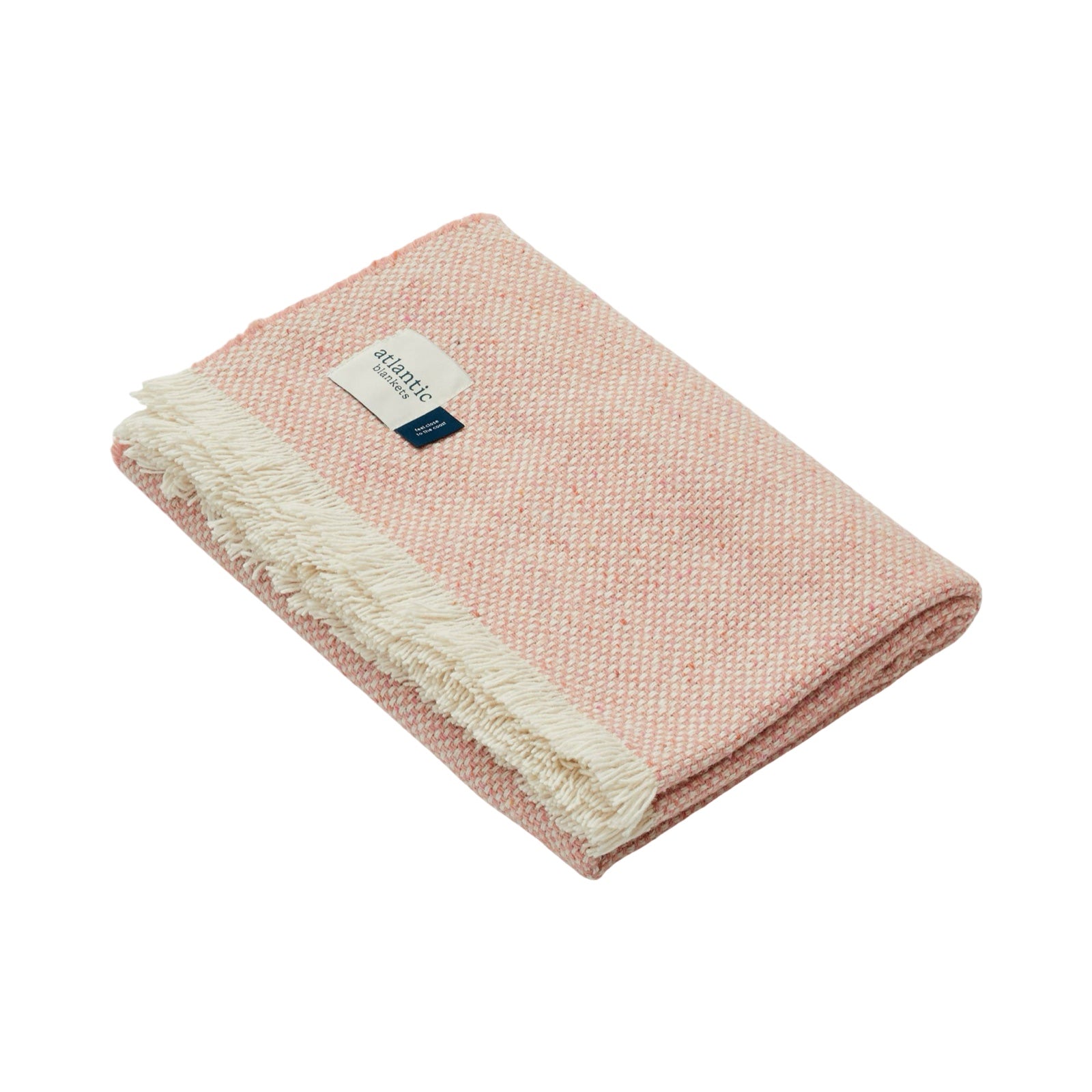 Cosy pink blanket folded up.