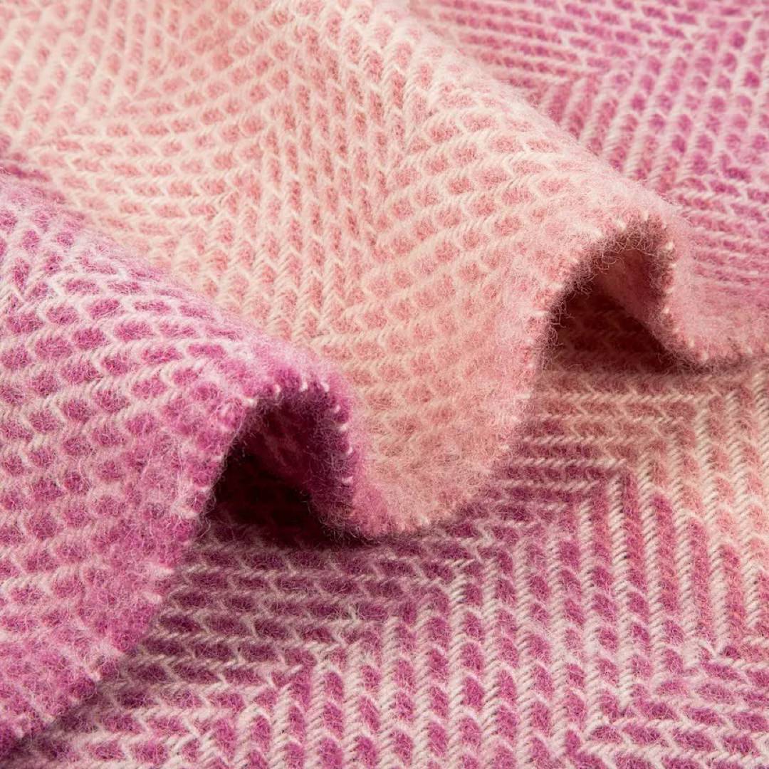 This pink, striped, cosy and fluffy blanket is made from 100% pure new wool and finished with extra brushing to make it exceptionally soft.