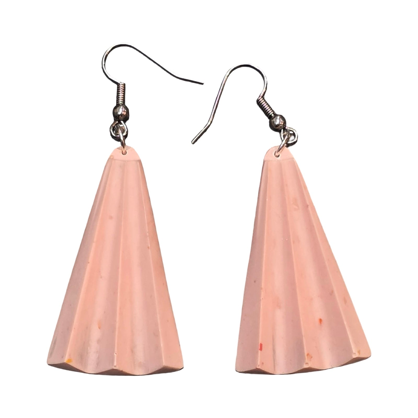 Pink earrings are shaped like rays of sunshine. 