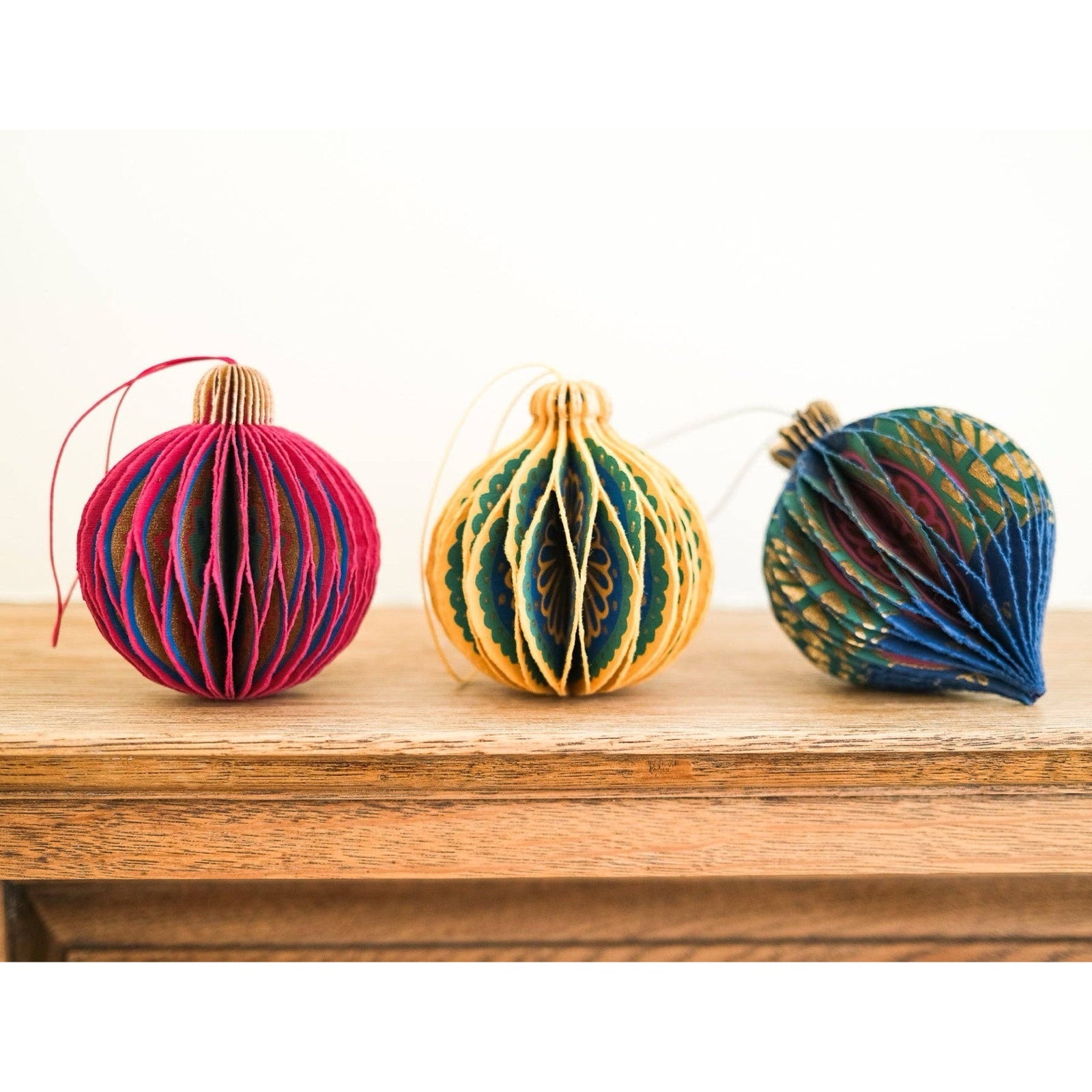 These gorgeous yellow and green honeycomb Christmas baubles are made from recycled cotton paper.