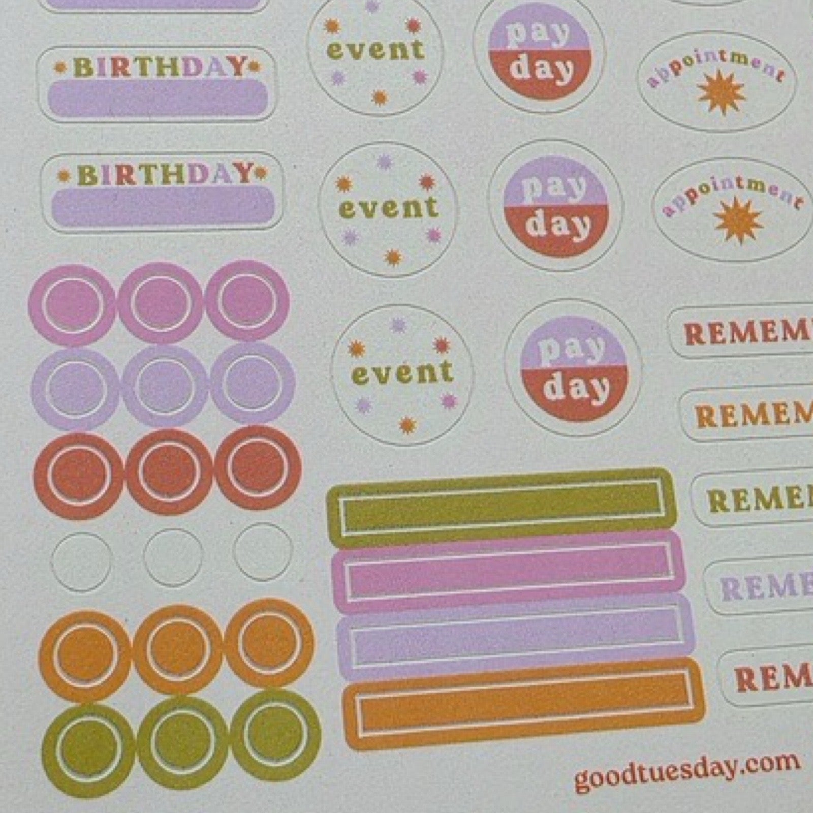 Two sheets of stickers in shades of pink, purple, orange and red  including 'event', 'pay day', 'birthday' and 'remember'.