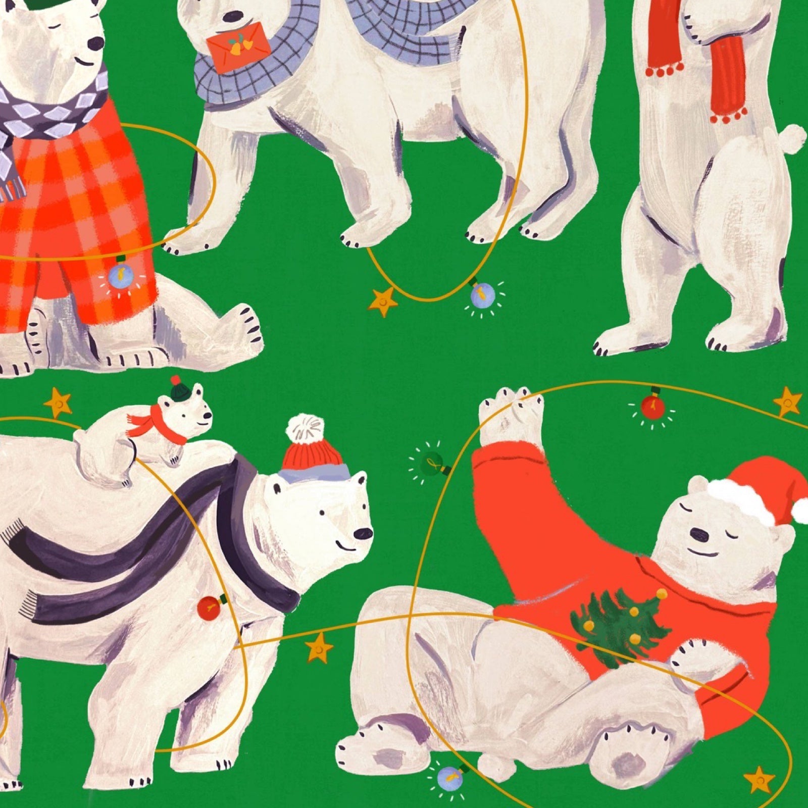 Christmas wrapping paper featuring polar bears in their winter woollies.