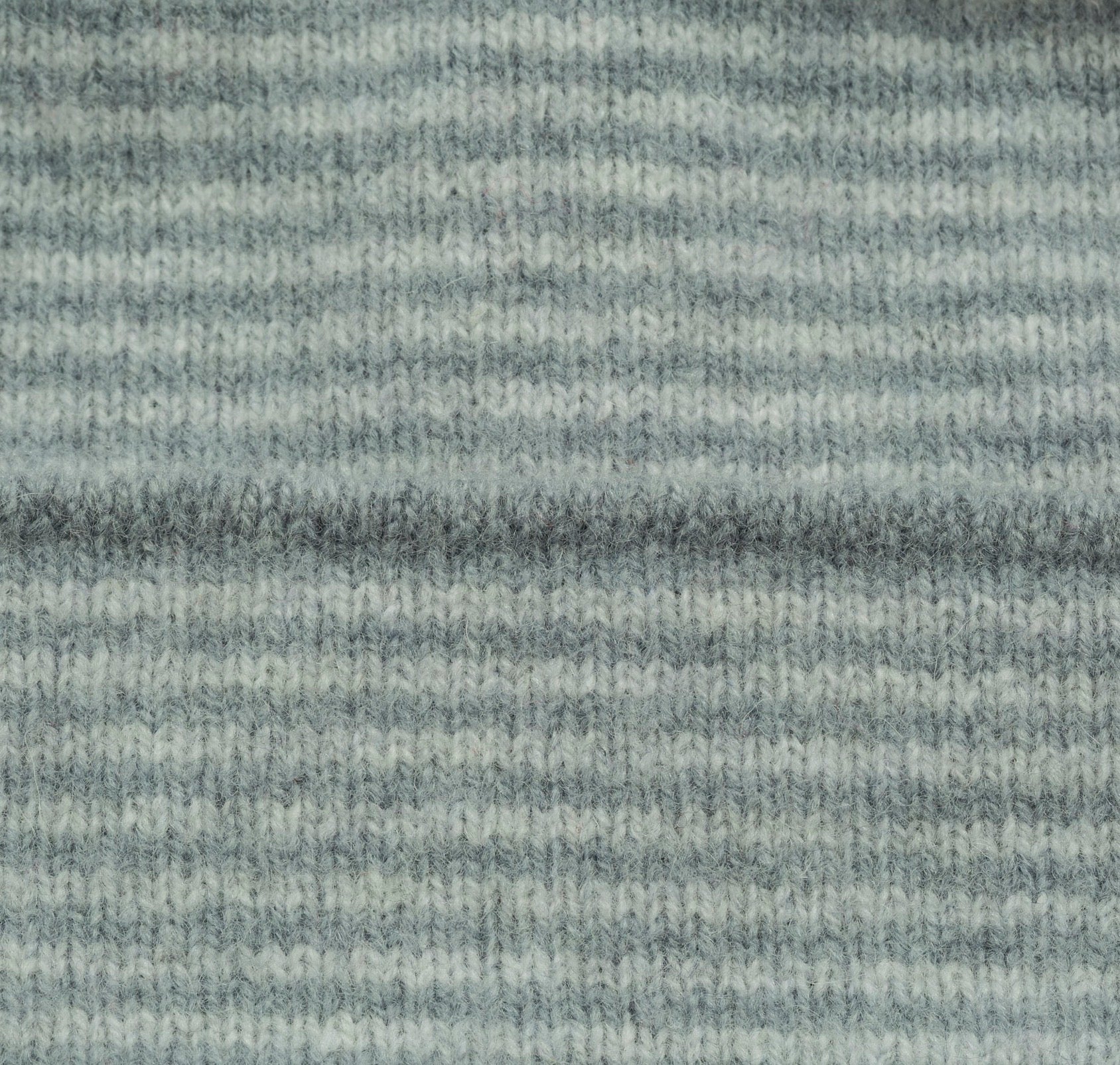 Textured gray fabric with horizontal stripes pattern.