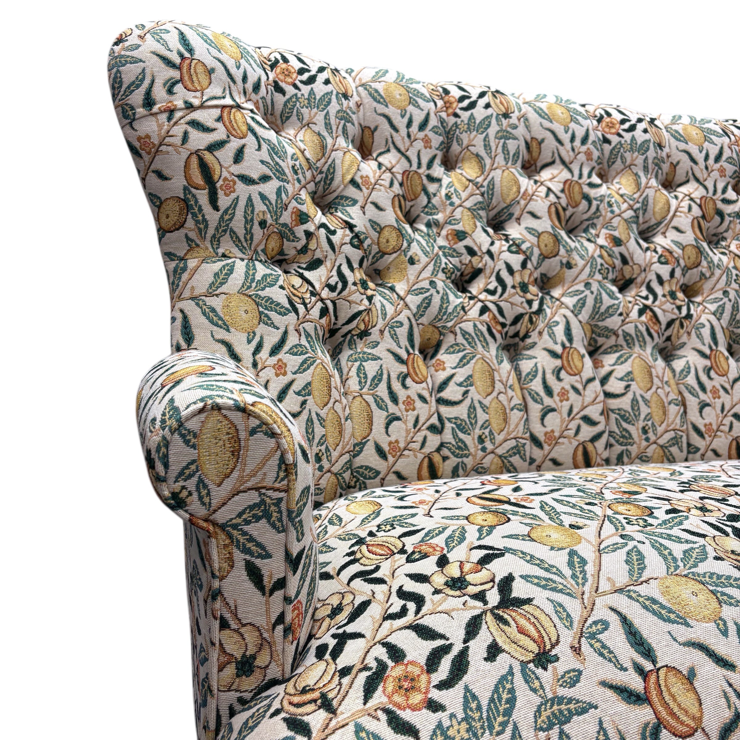 A beautiful hand-crafted occasional two-seater sofa with a high button back covered in gorgeous fabulous&nbsp;woven William Morris style pomegranate fruits fabric in cream with yellow fruit.