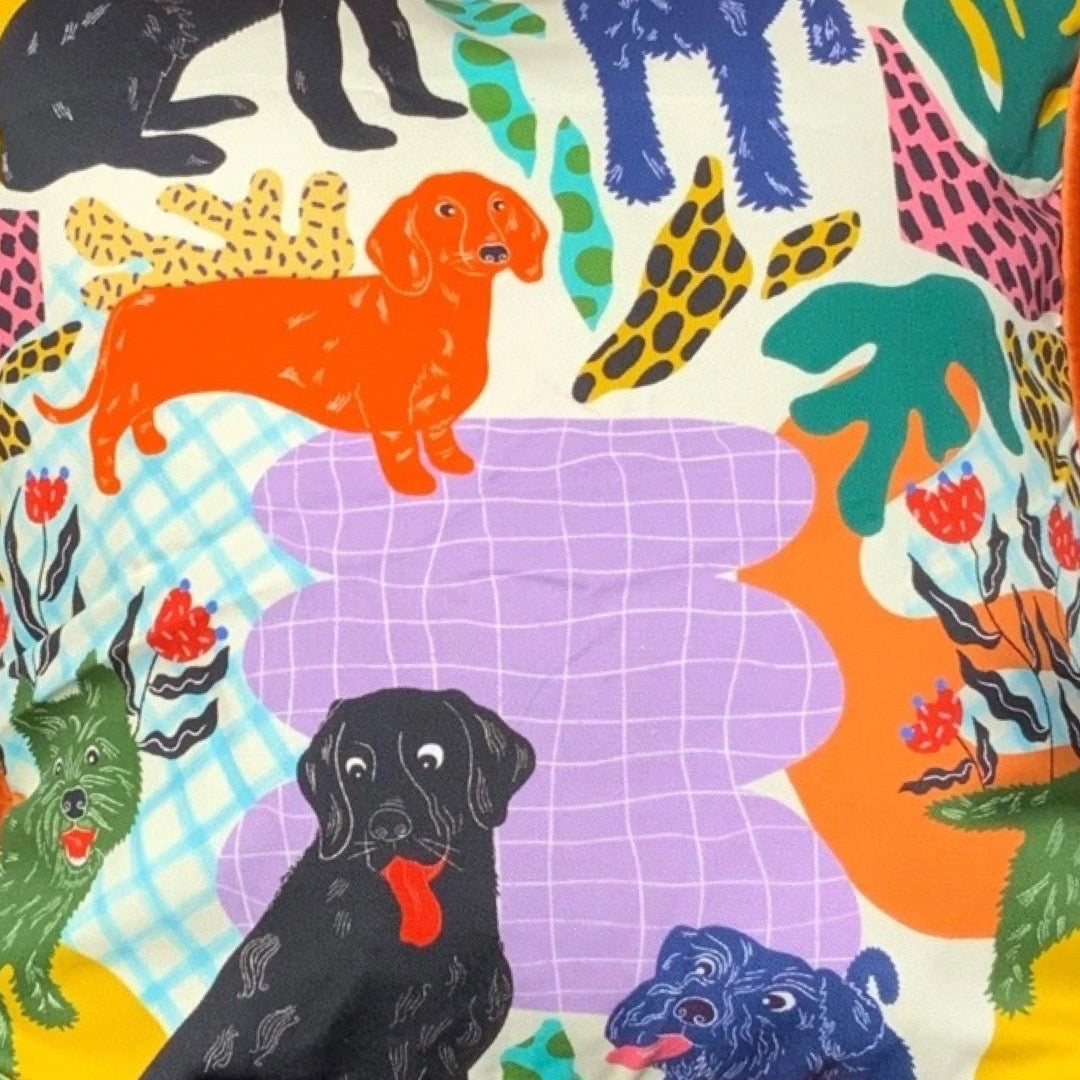Poochie fabric featuring black labradors, orange dachshunds and green scottie dogs.