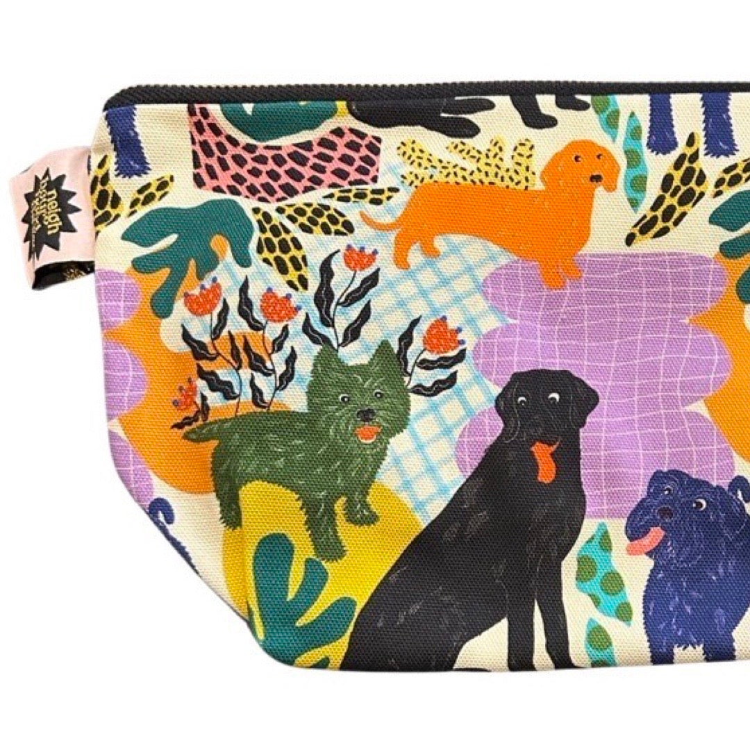 Large zip pouch in poochie fabric featuring black labradors, orange dachshunds and green scottie dogs.