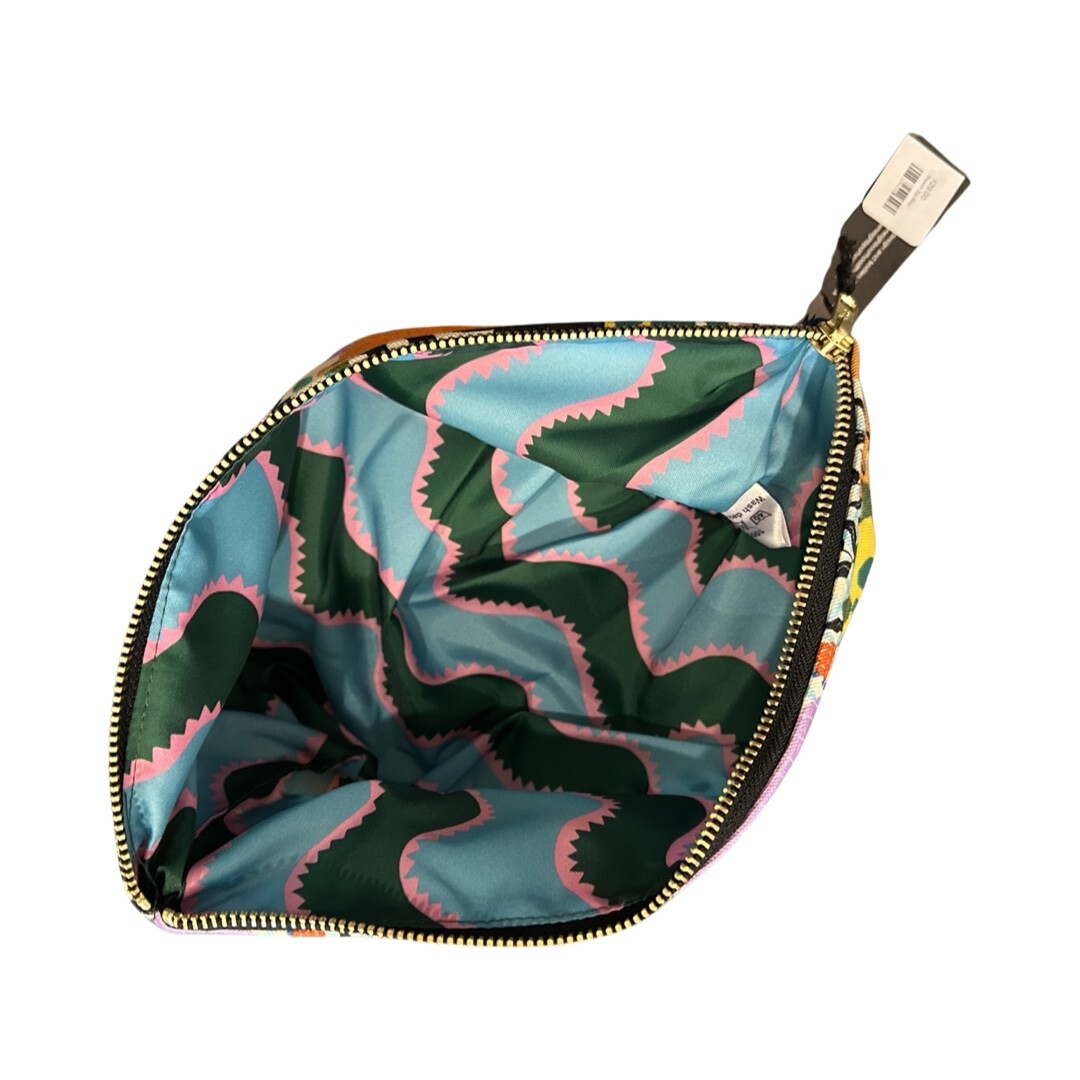 Turquoise, green and pink striped waterproof lining of poochie zip bag.