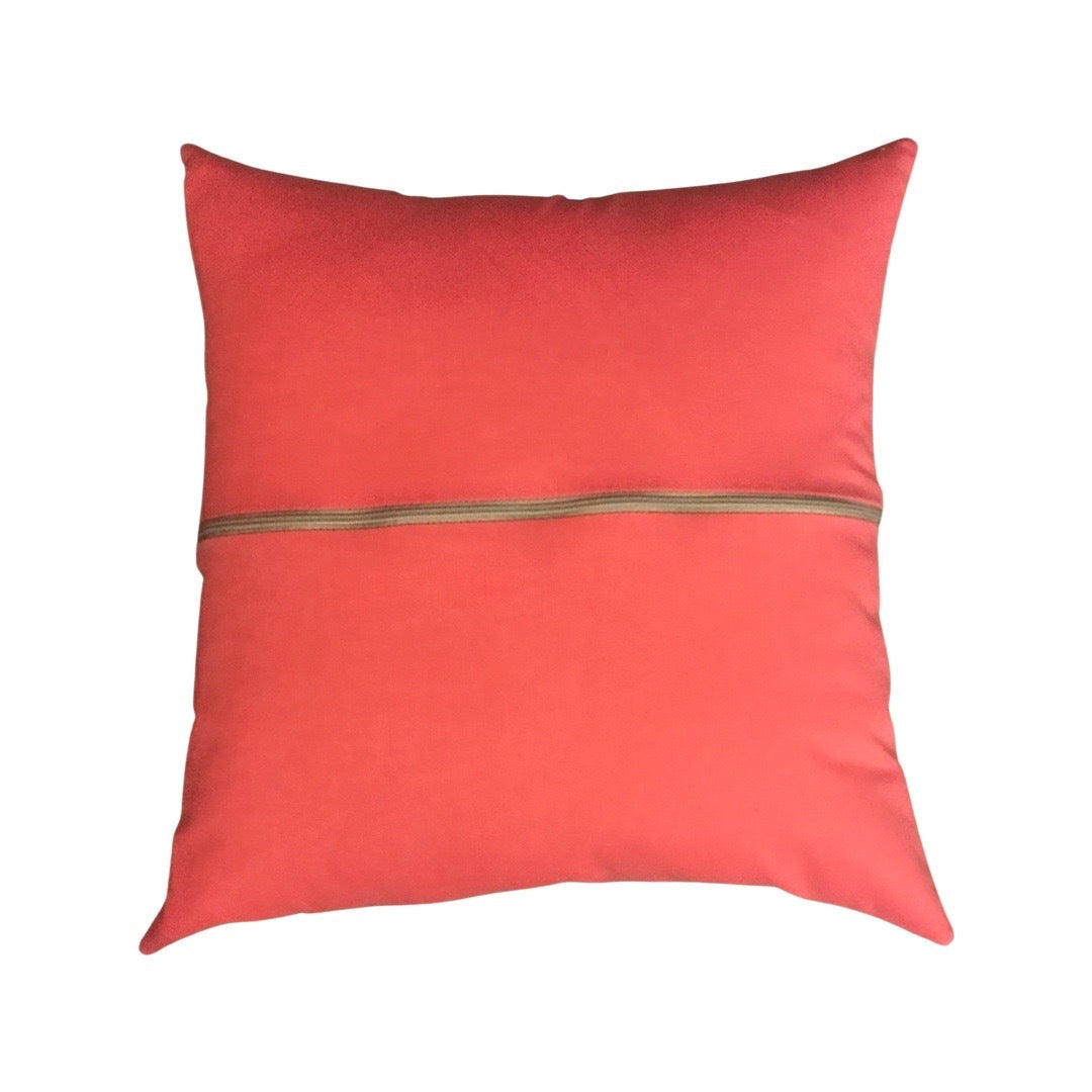 Back of cushion in pink with a grey zip.