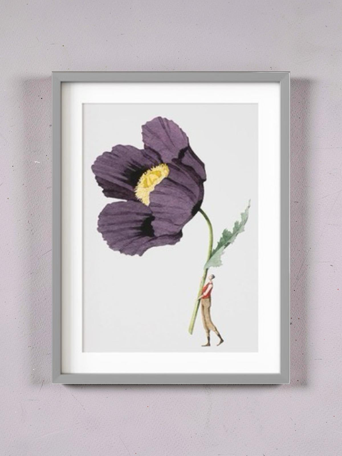 Framed artwork of a purple flower with a person inside on a light grey wall.
