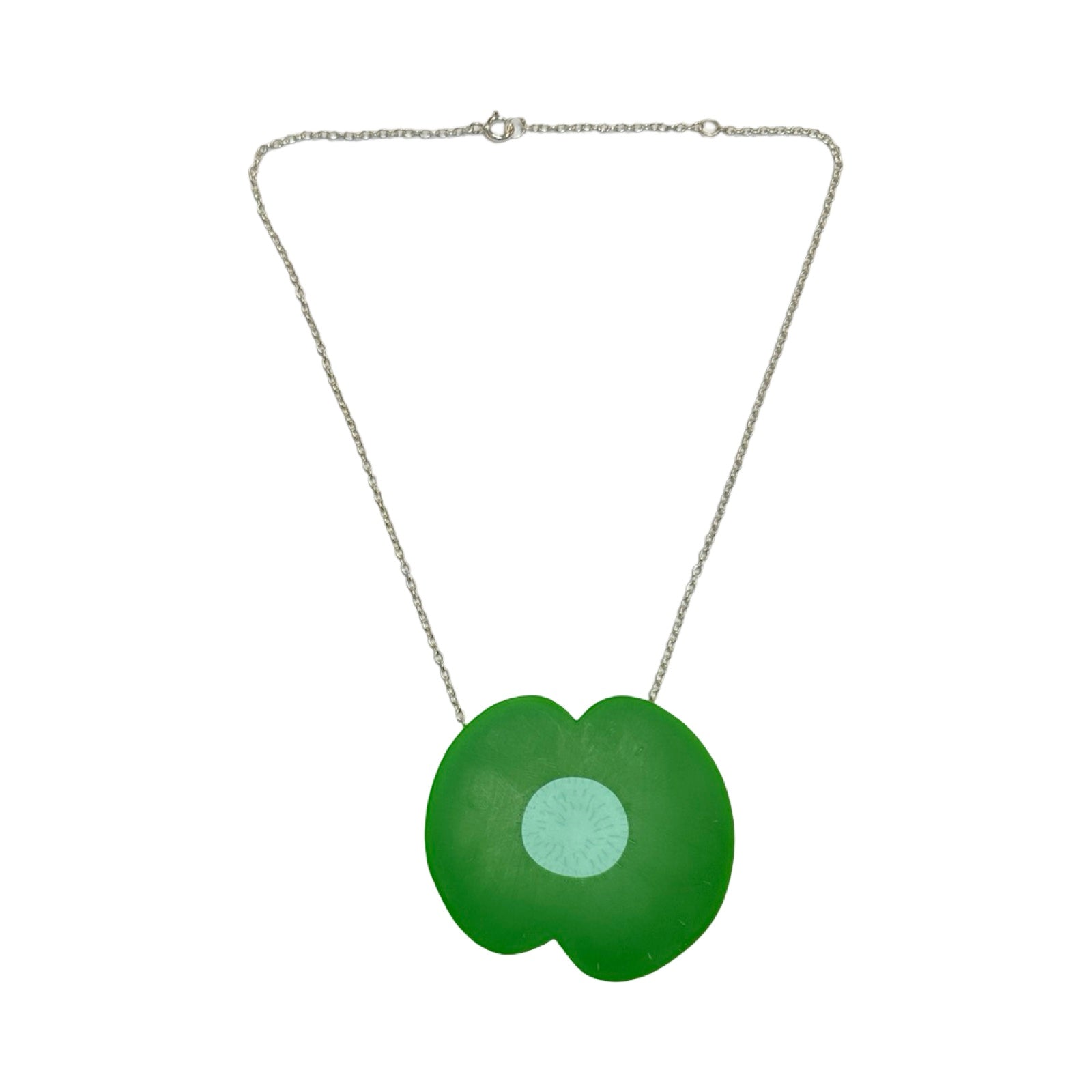 A green resin poppy-shaped necklace with a pale green centre on a silver chain.