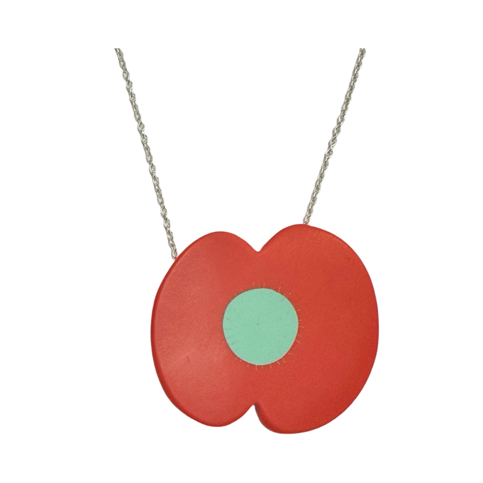 A red resin poppy-shaped necklace with a green centre on a silver chain.